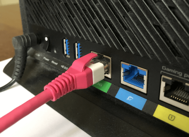 An Ethernet cable plugged into a home router